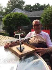Jack Ackerman (retired) with a model of a Halifax bomber donated to him by a grateful audience member.
